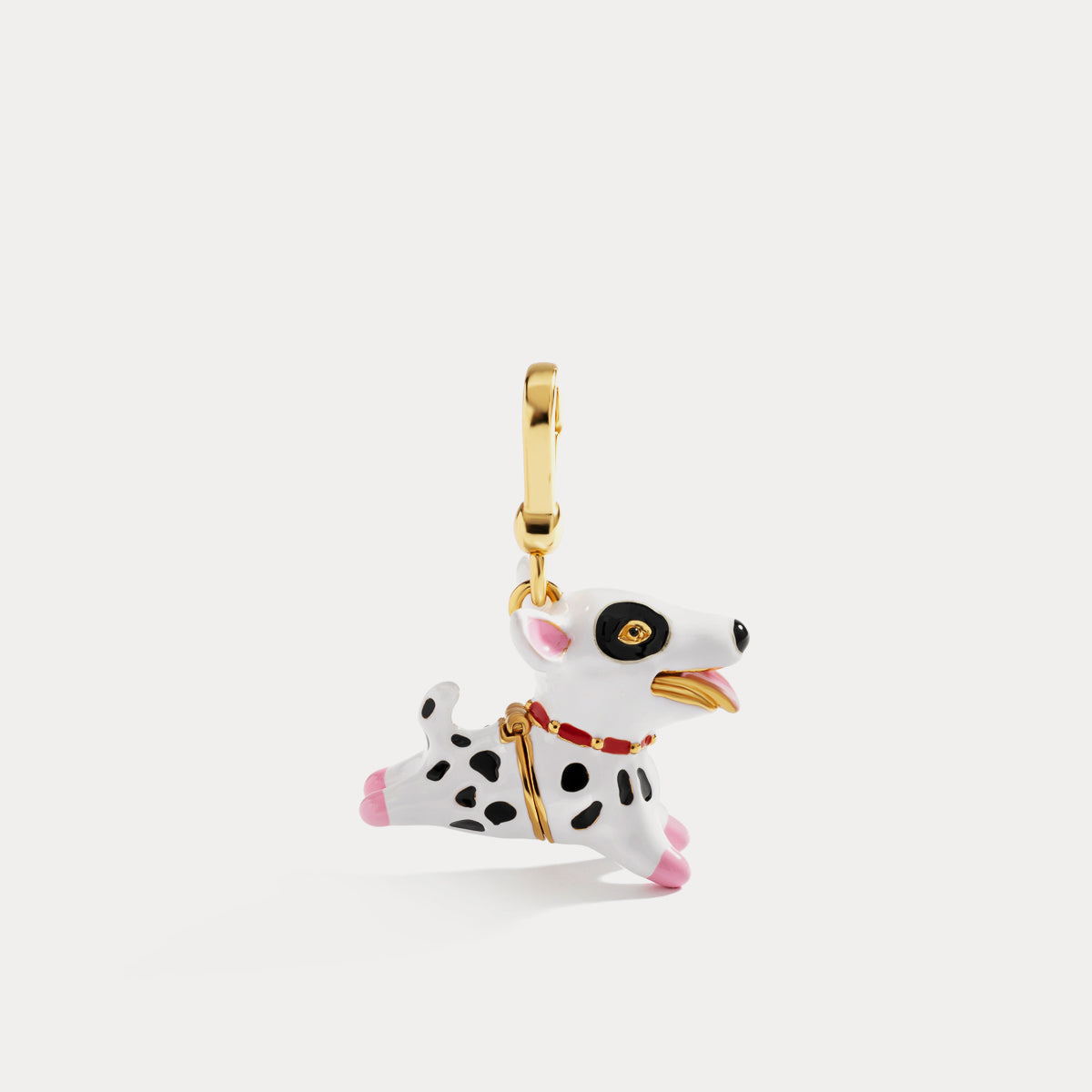 Side view of Dalmatian pendant locket showing enamel finish and gold clasp