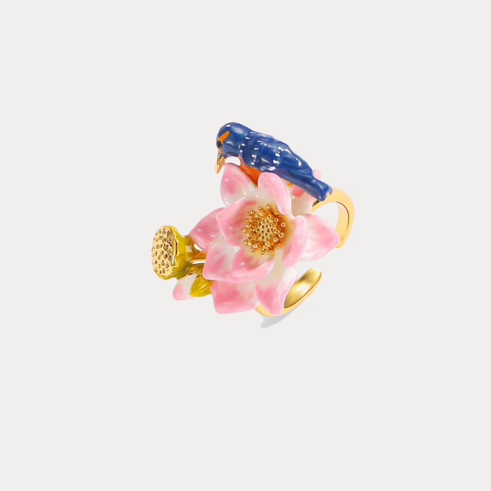 Adjustable gold ring featuring a pink enamel lotus flower and a blue kingfisher perched on top