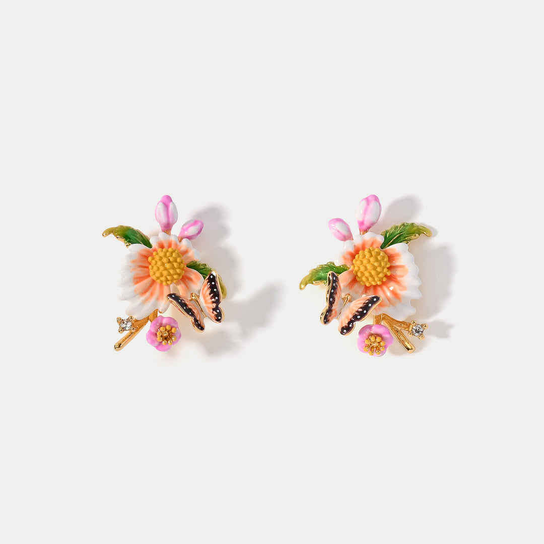 Pair of Lotus Dragonfly Bracelets with lotus flower, butterfly, and leaf detailing, photographed on a plain background.