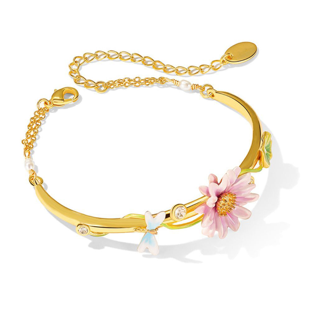 Lotus Dragonfly Bracelet laid flat with enamel flower, crystal accents, and adjustable extender chain