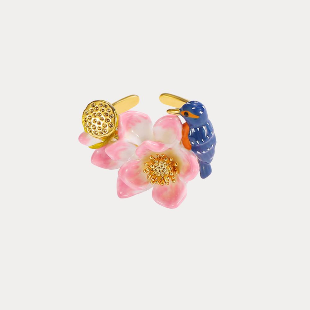 Model wearing the Kingfisher Lotus Ring and matching hoop earrings showcasing a floral and bird