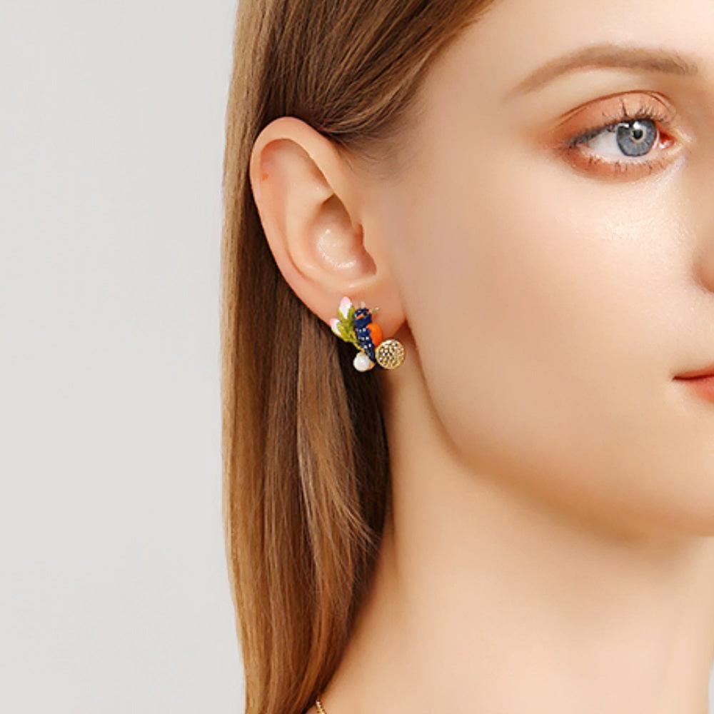 Model wearing matching Kingfisher Lotus Stud Earrings on both ears, with visible pink buds, golden lotus details, and pearls.