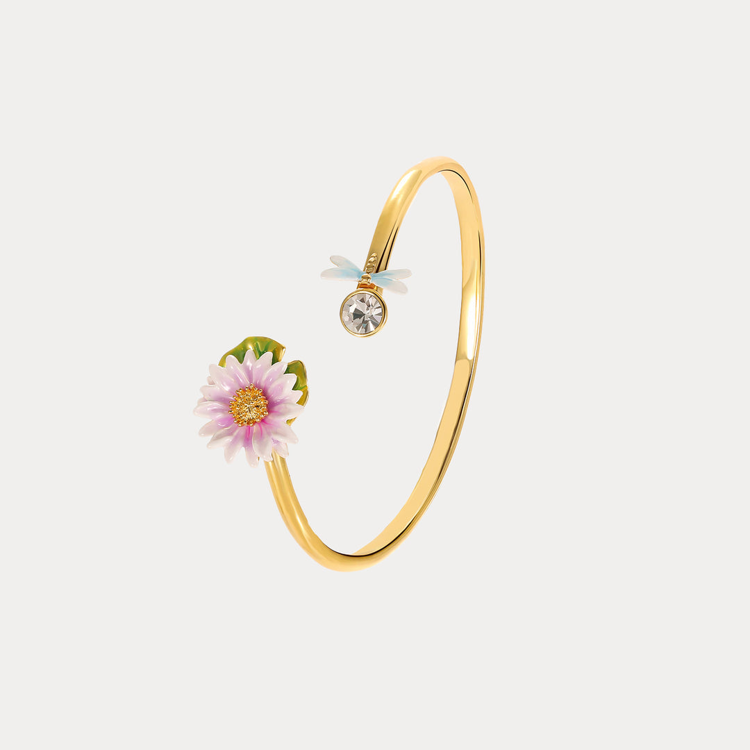 Elegant tilted display of the Lotus Dragonfly Bracelet with detailed lotus enamel work and sparkling crystal accent.