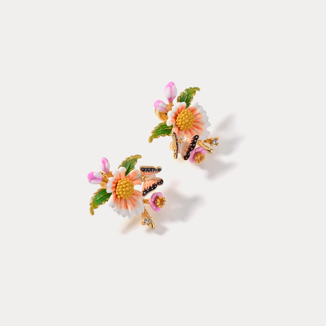 Gold-tone Lotus Dragonfly Bracelet with pink and green enamel details, displayed on a white background.