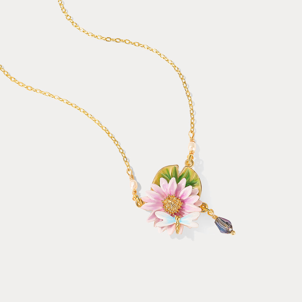 Detailed image of lotus dragonfly necklace showing delicate gold chain with floral centerpiece and dragonfly accent.