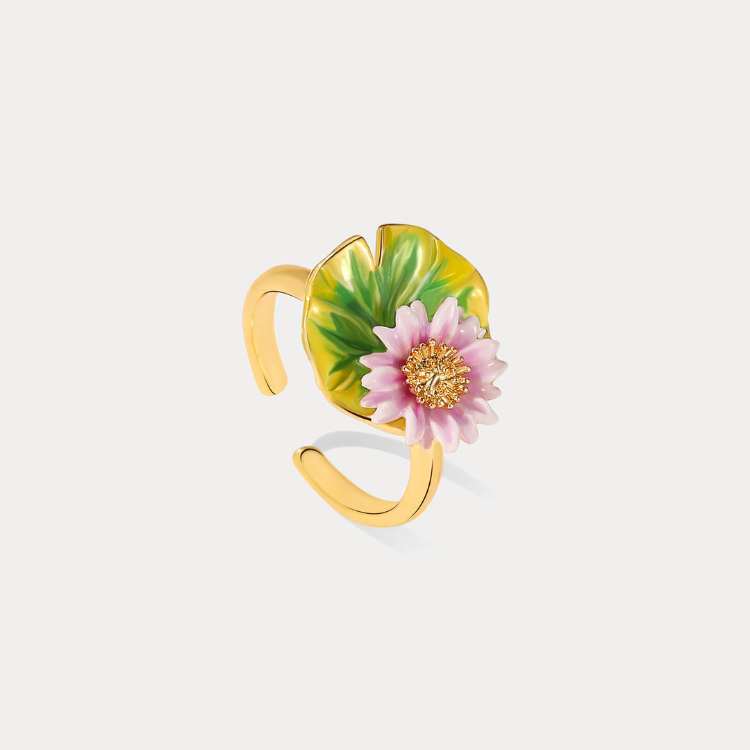 Front view of enamel lotus flower ring with adjustable gold-tone open band.