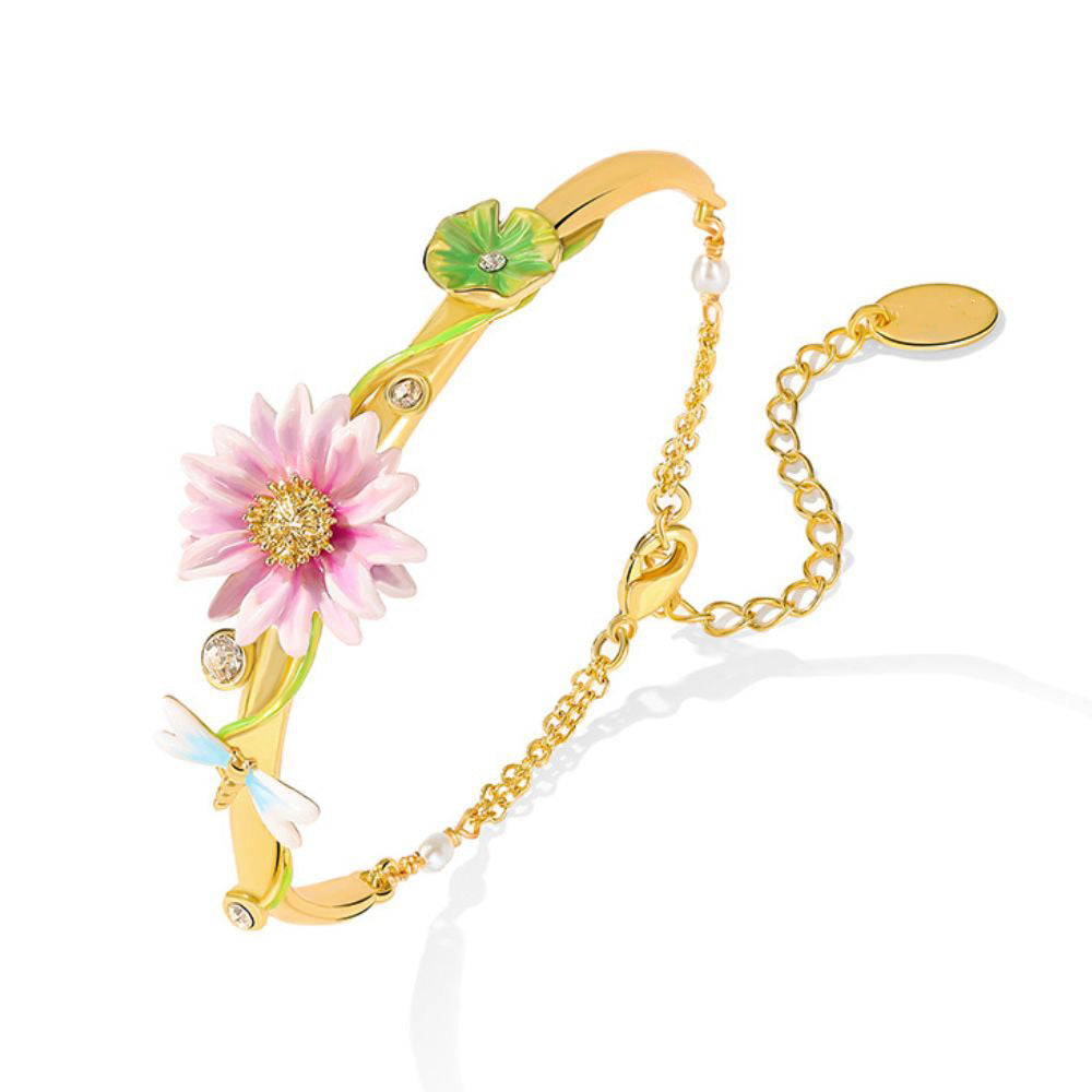 Model showing the Lotus Dragonfly Bracelet on wrist with visible floral and dragonfly detailing
