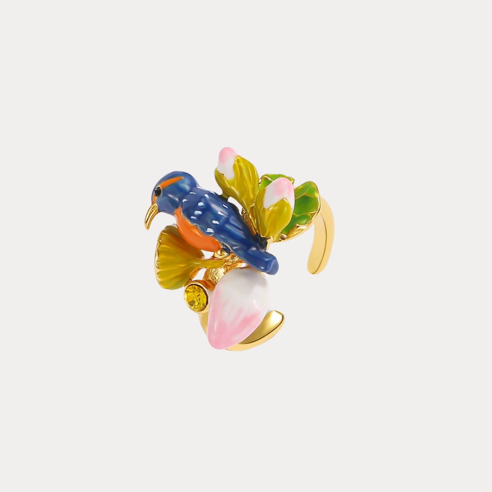 Side view of Kingfisher Lotus Ring showing the vibrant bird figure and blooming flower details