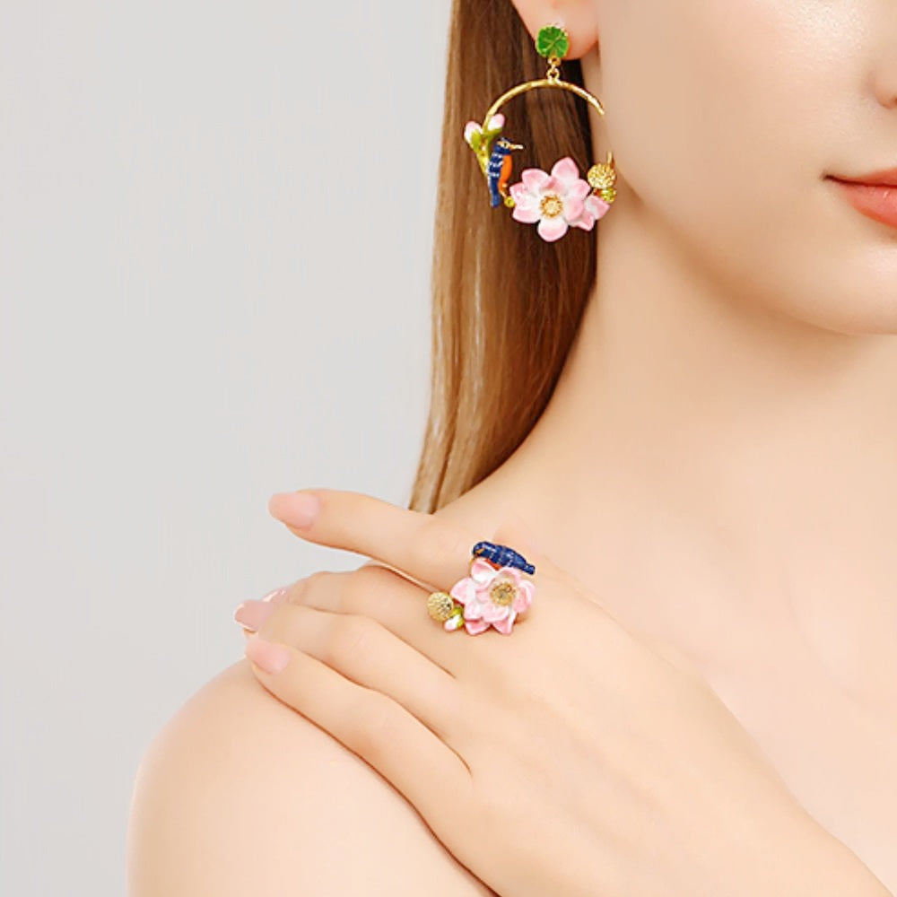 Elegant side angle of a model displaying the Kingfisher Lotus Ring with floral and bird accents