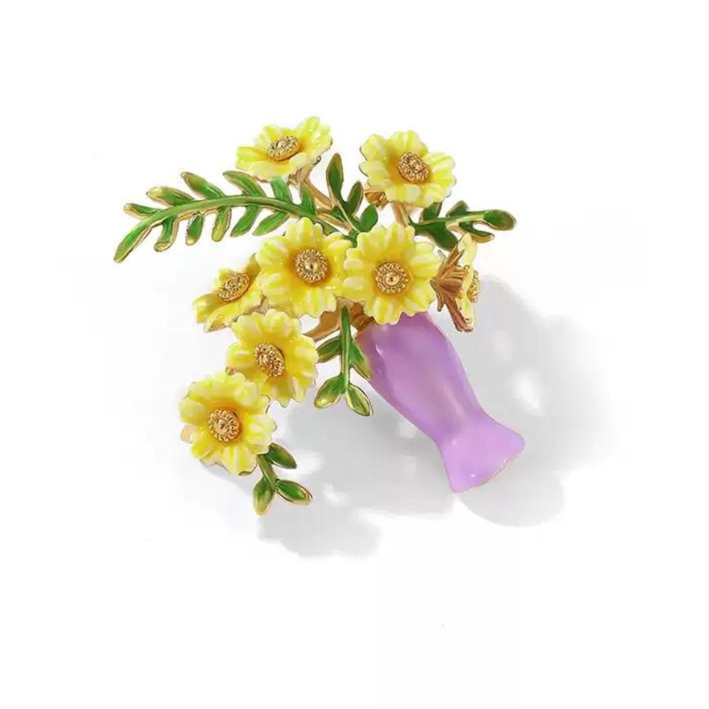 Close-up of model wearing sunflower brooch pinned on a light beige blazer, highlighting the floral design