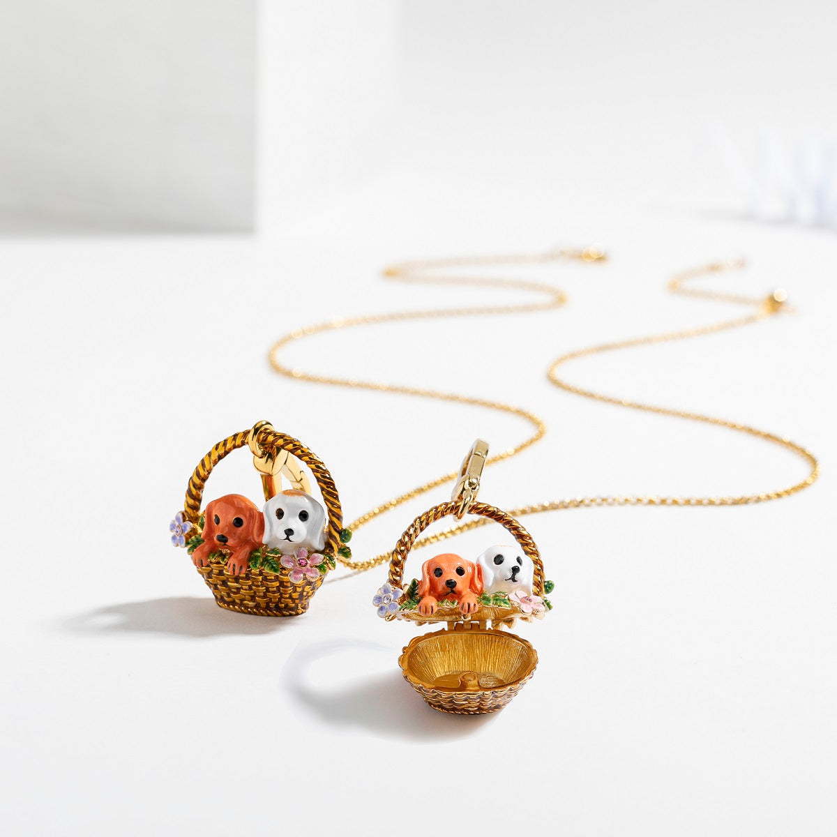 Openable Puppy Locket Pendant Necklace showing two enamel puppies in a floral basket, ideal for keepsake storage.