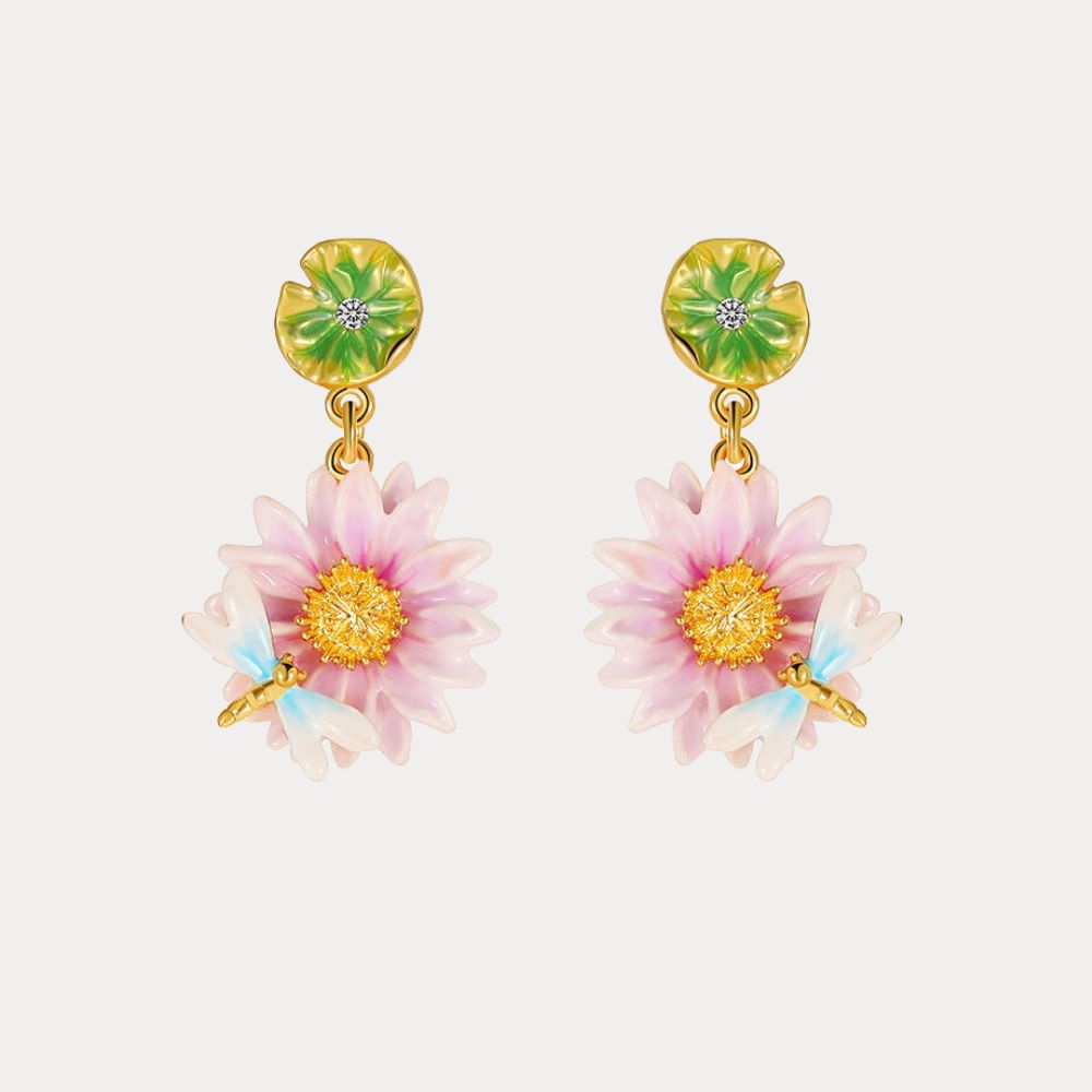 Close-up view of the Lotus Dragonfly Earrings with pink lotus flowers and delicate blue dragonflies, accented by green lily pad studs.