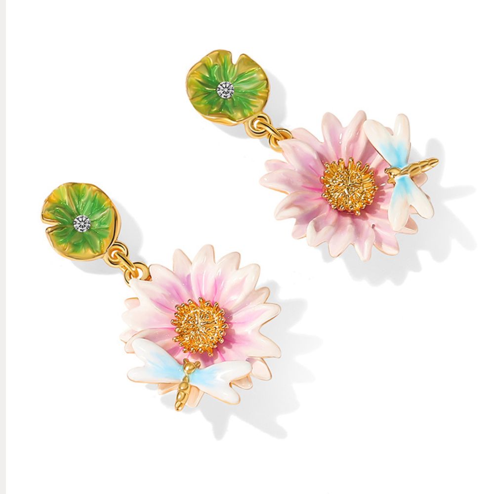 Close-up view of the Lotus Dragonfly Earrings with pink lotus flowers and delicate blue dragonflies, accented by green lily pad studs.