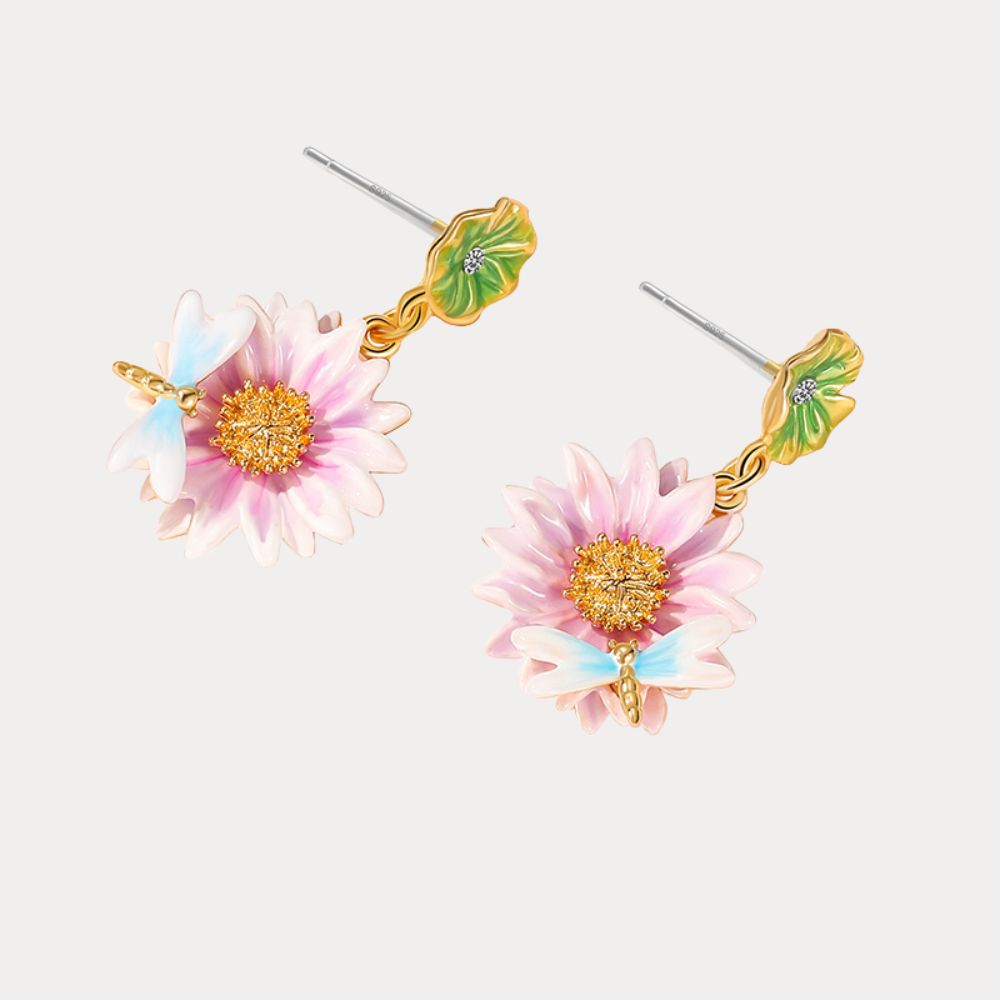 Close-up view of the Lotus Dragonfly Earrings with pink lotus flowers and delicate blue dragonflies, accented by green lily pad studs.