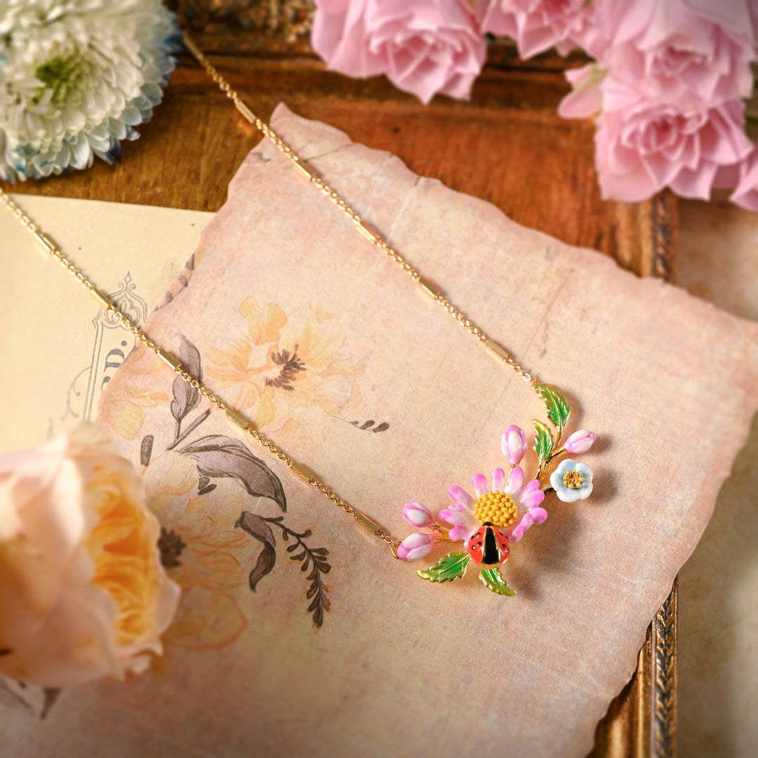 Detailed view of Daisy Ladybug Necklace among floral decor
