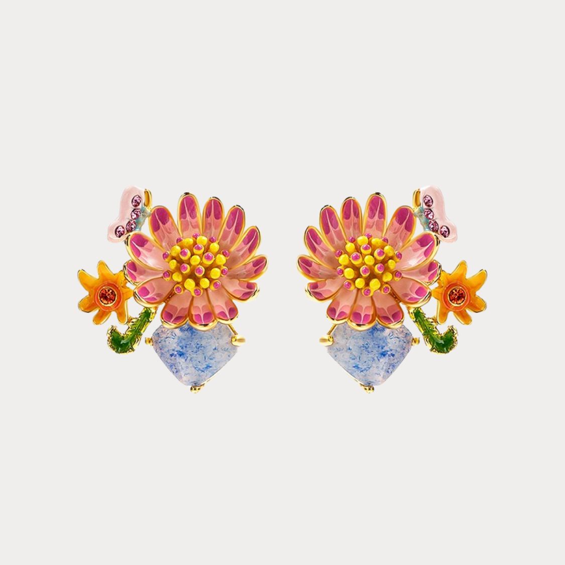 Symmetrical product display of Daisy Blossom Stud Earrings with pink petals and colorful accents