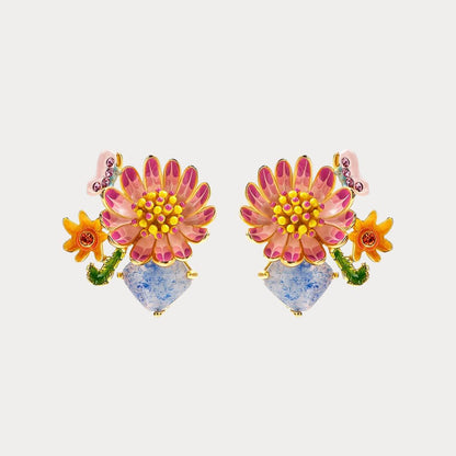 Symmetrical product display of Daisy Blossom Stud Earrings with pink petals and colorful accents