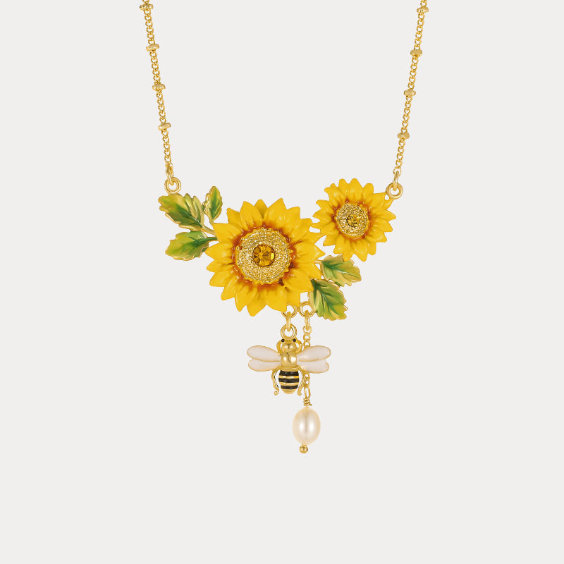 Direct product shot of Verdivine sunflower necklace with yellow enamel petals and hanging bee charm