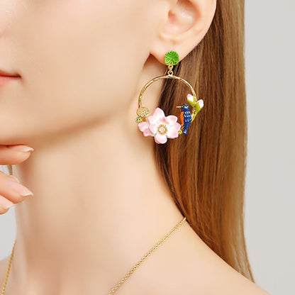 Model wearing a full set including Kingfisher Lotus Hoop Earrings and a matching necklace, showing a complete coordinated floral jewelry look.