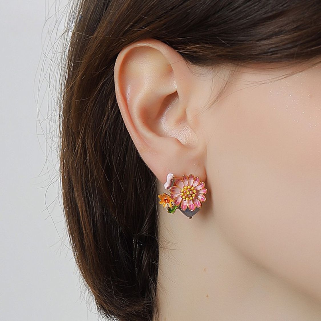 Close-up of model wearing Daisy Blossom Stud Earrings highlighting floral design