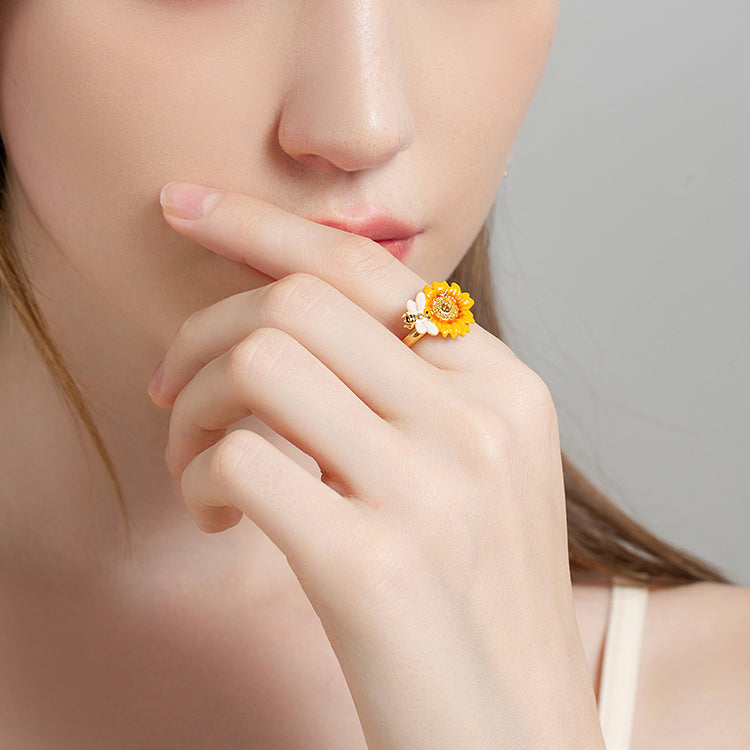 Model wearing Verdivine sunflower ring with bee detail in a close-up pose