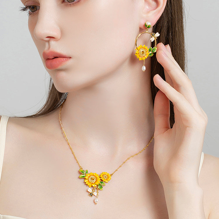 Model wearing Sunflower Hoop Earrings With Pearl, showcasing floral hoop design