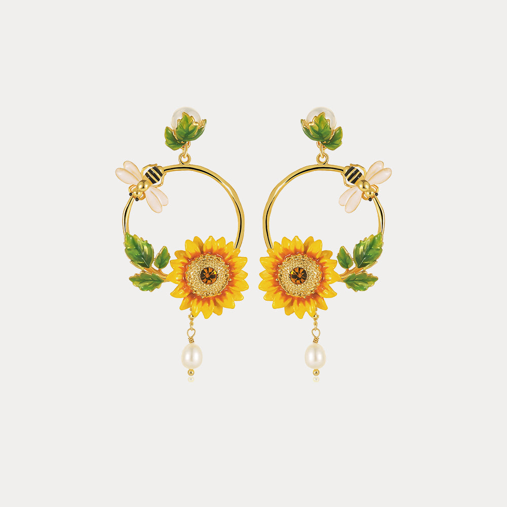 Front view of Sunflower Hoop Earrings with symmetrical sunflower designs and bee details