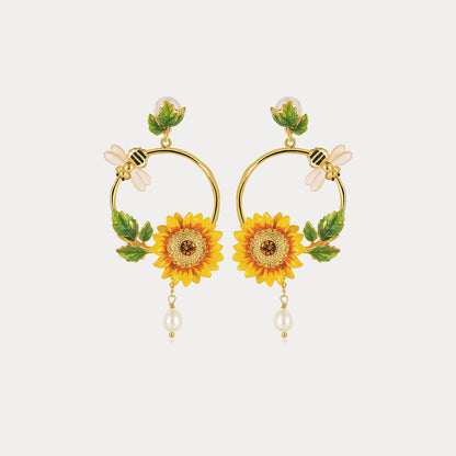 Front view of Sunflower Hoop Earrings with symmetrical sunflower designs and bee details